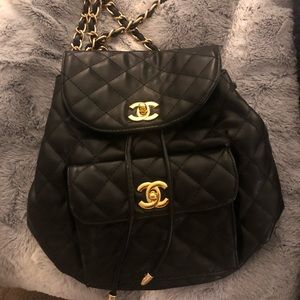 Quilted black and gold backpack